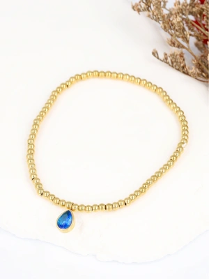 Bransoleta na gumce złote kulki z zawieszką szafir